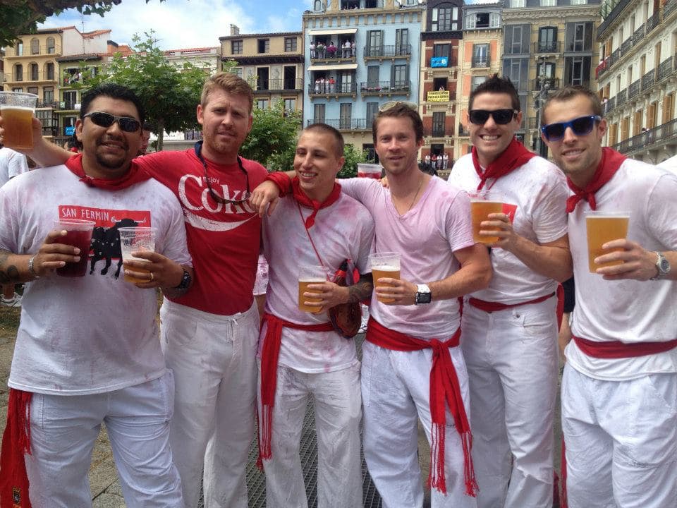 students wearing the traditional red-and-white San Fermín attire