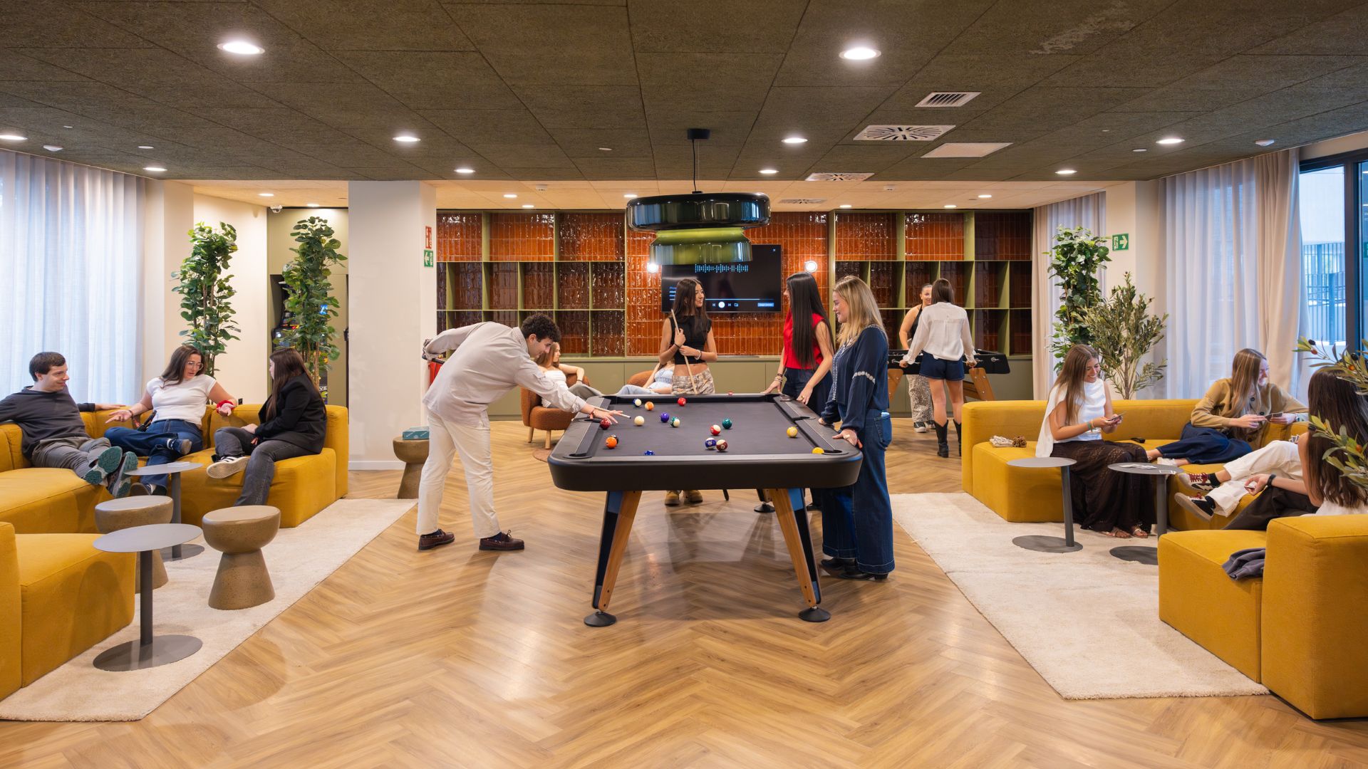 A group of students spending time together in a relaxed common area