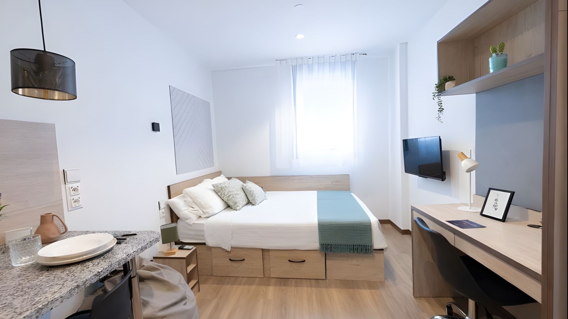 A tidy, modern room in a college dorm